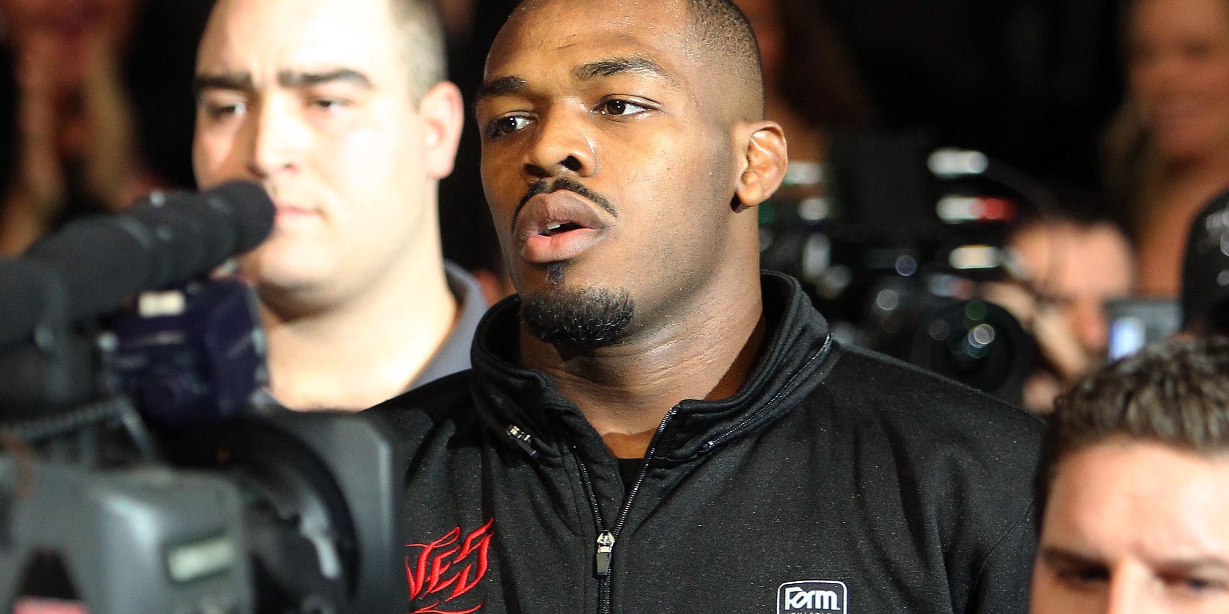 jon-jones-jogging-to-the-cage-in-a-black-jacket