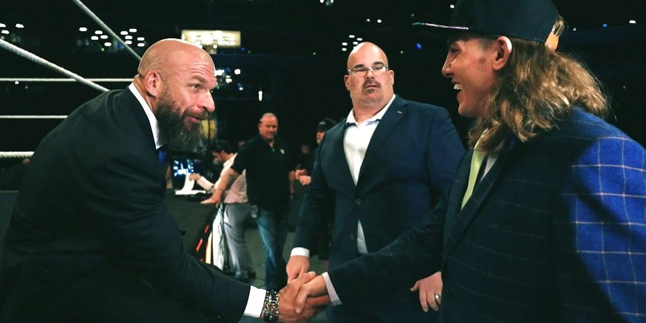 Riddle and Triple H shake hands 