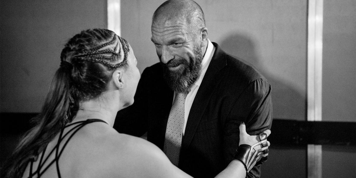 Ronda Rousey talking with Triple H 