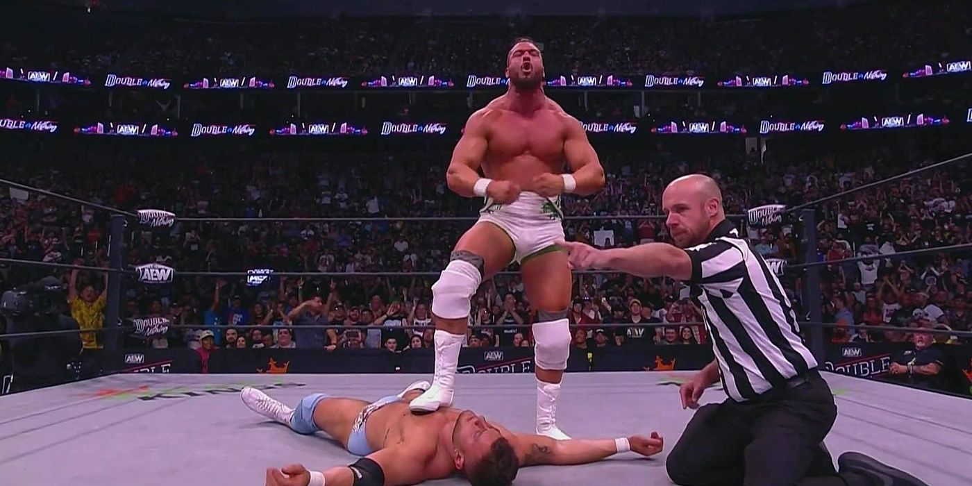 Wardlow posing over a knocked-out MJF