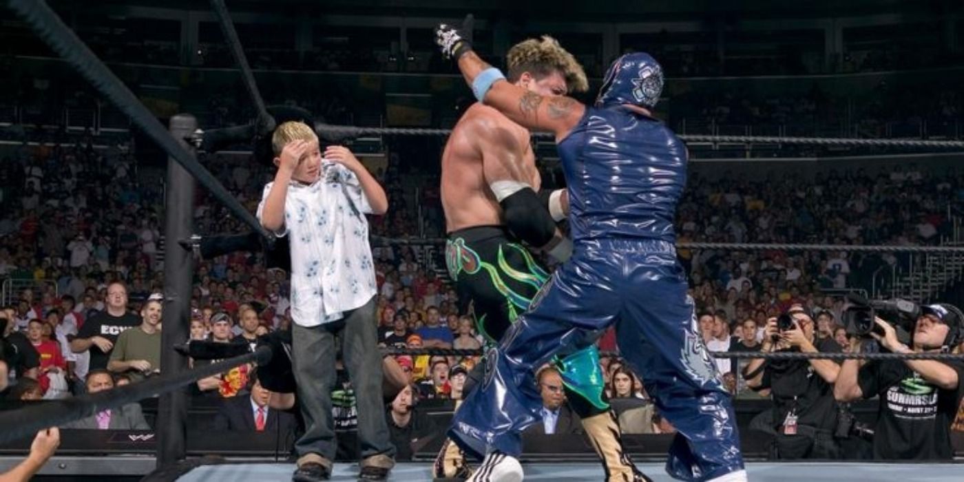 Rey Mysterio fighting Eddie Guerrero in front of Dominik