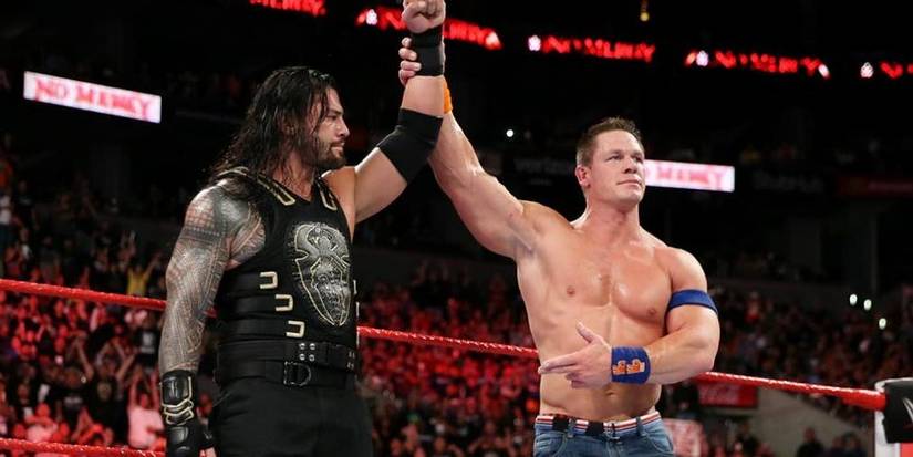 john-cena-raising-roman-reigns-arm-2