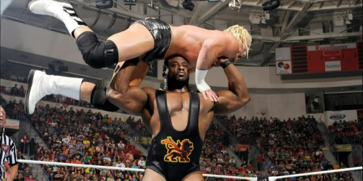 Big E with Dolph Ziggler over his head