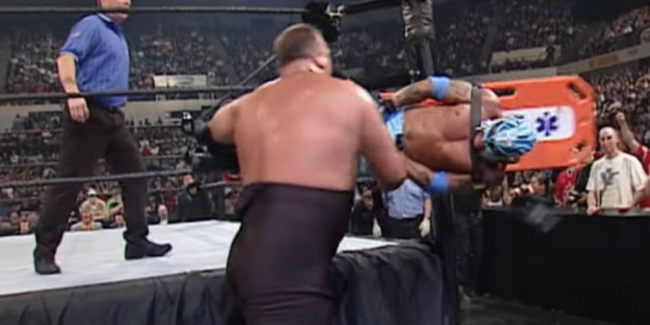 Big Show slams Rey Mysterio into the ringpost Cropped