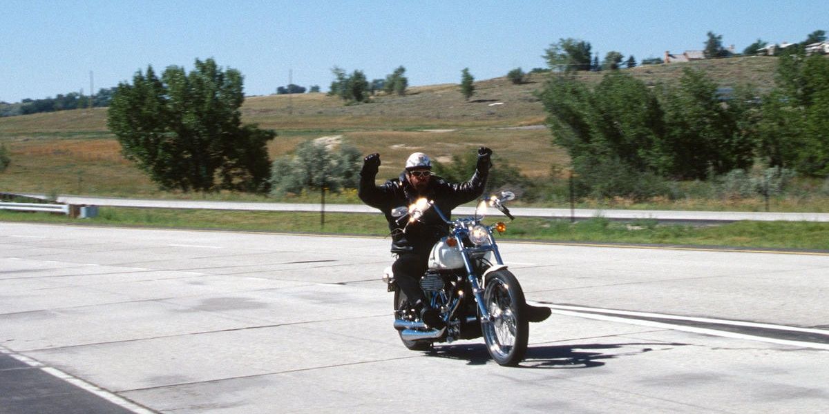 Goldberg riding a motorcycle 