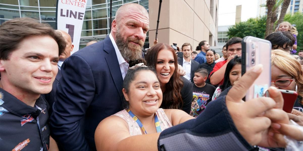 Triple H and Stephanie McMahon with fans