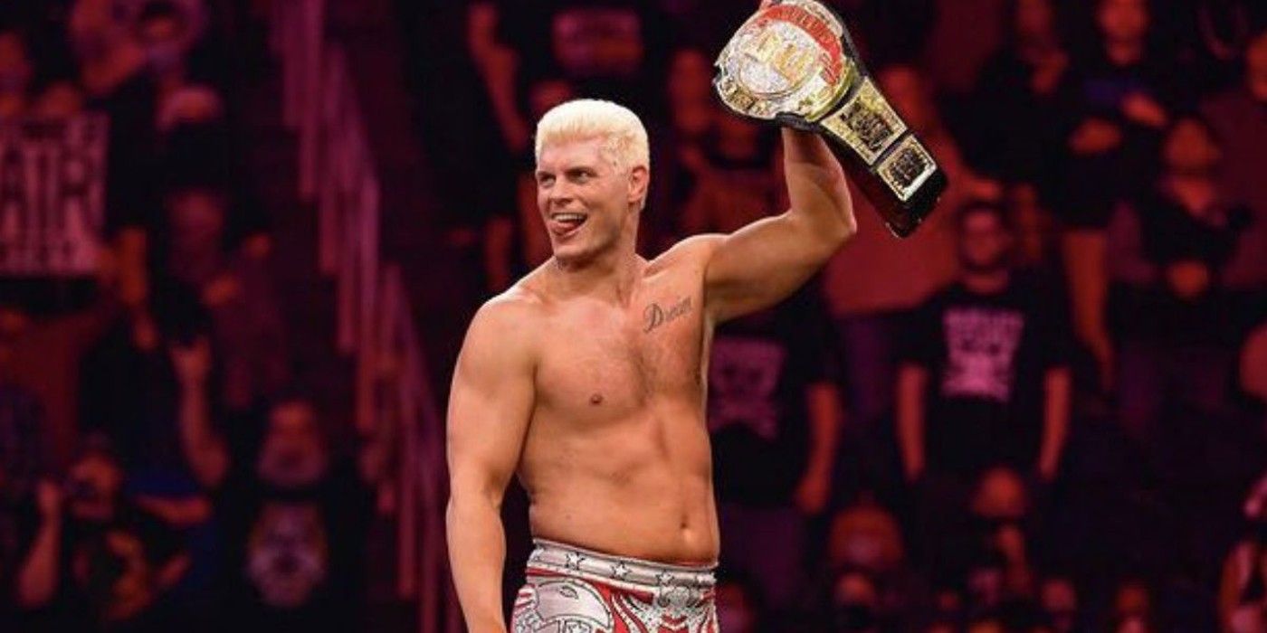 cody rhodes holding up the tnt title