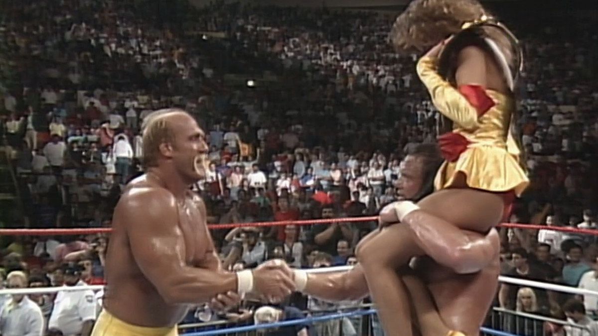 hogan and savage celebrate their win with miss elizabeth