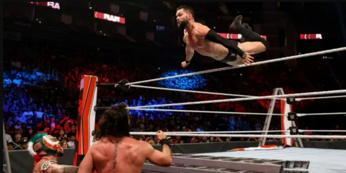 Finn-Balor-leaps-over-the-top-rope-on-Raw-1