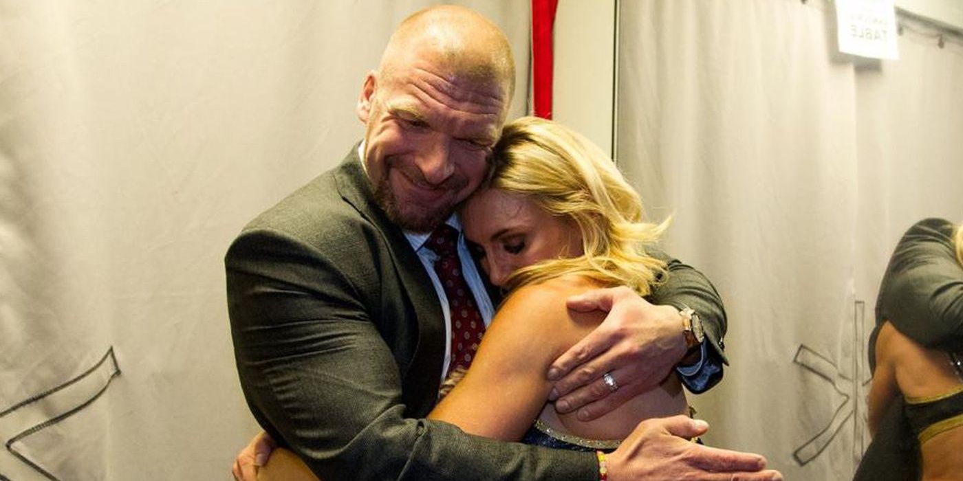 Triple H and Charlotte hug 