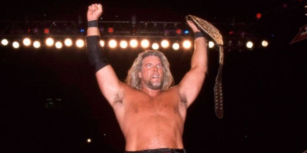 Kevin Nash holding up the WCW Championship. 