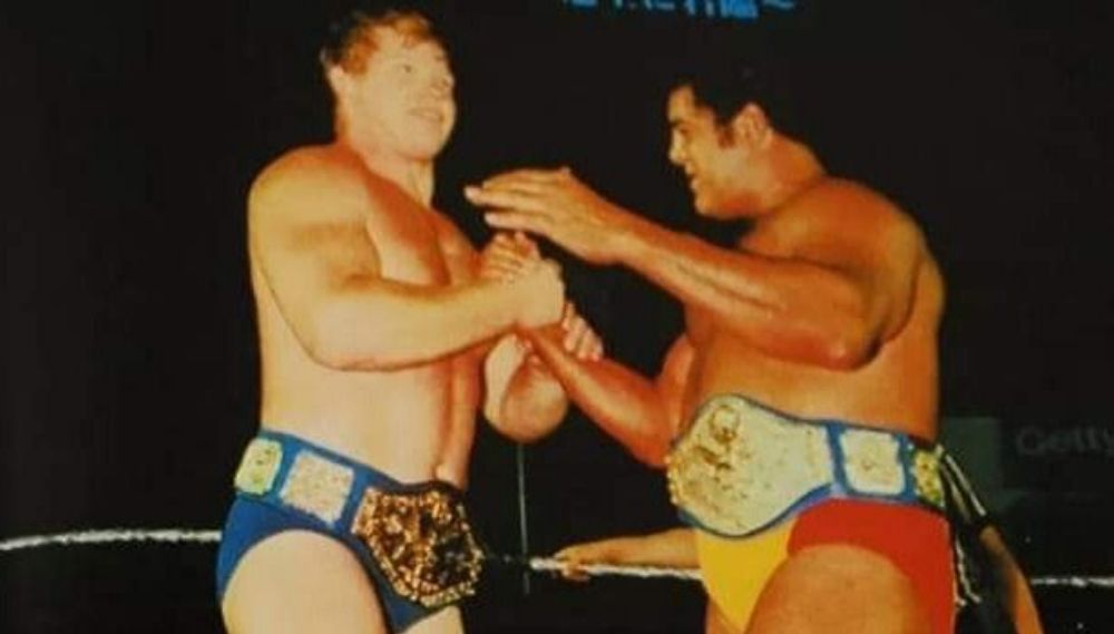 Pedro Morales and Bob Backlund with the WWE Tag Team Championship