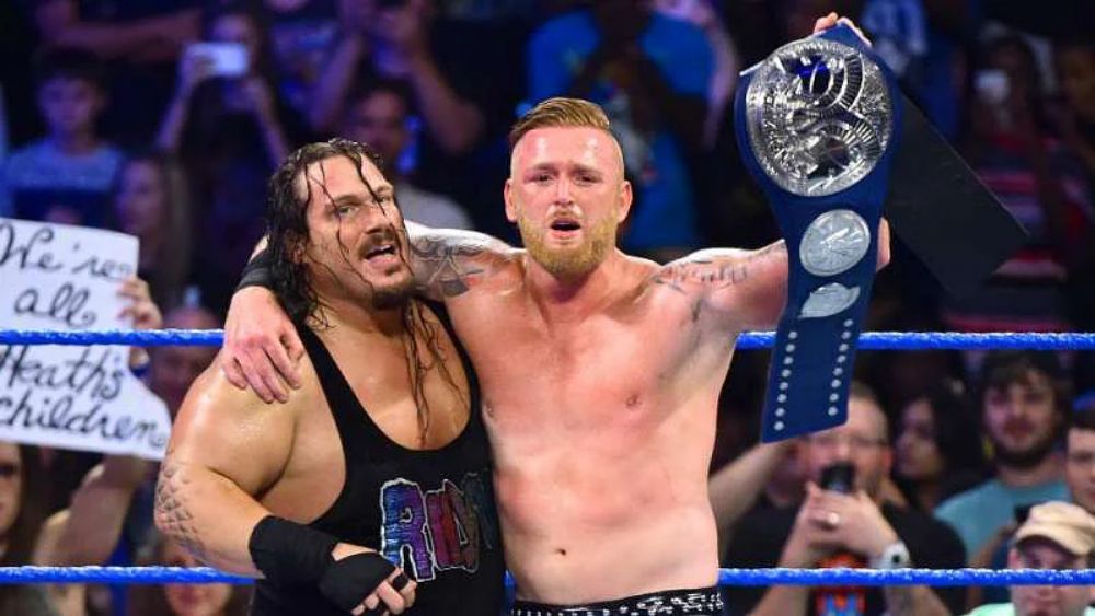Rhyno and Heath Slater with the SmackDown Tag Team Championship