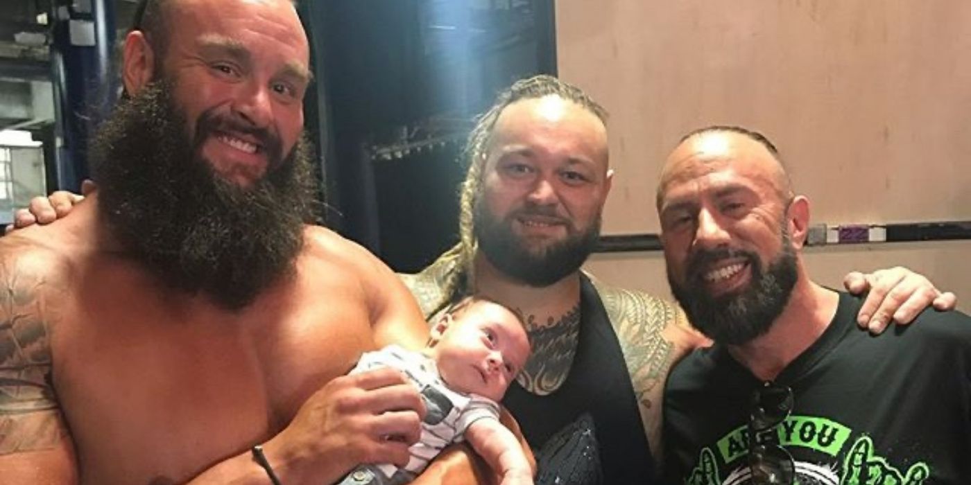 Braun Strowman holding Bray Wyatt's son