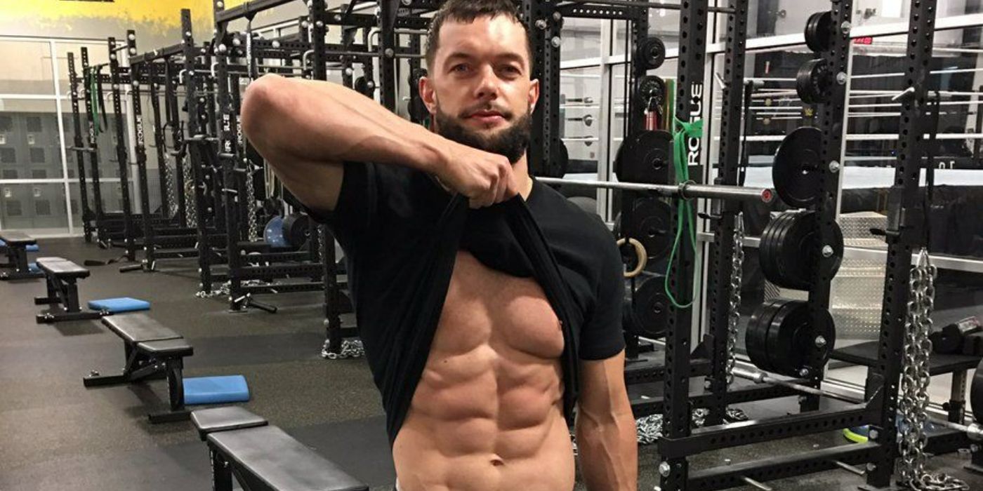 Finn Balor showing off his abs