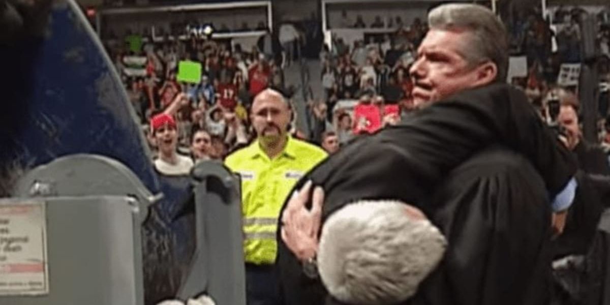 Vince McMahon with Eric Bischoff in his arms