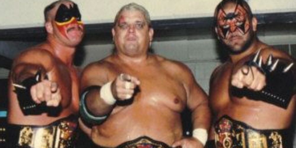 Dusty Rhodes with the Road Warriors in the NWA.