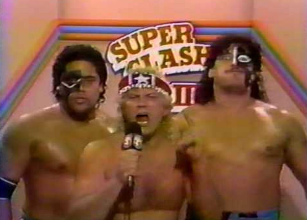 The Samoan Swat Team with Buddy Roberts at Super Clash 3