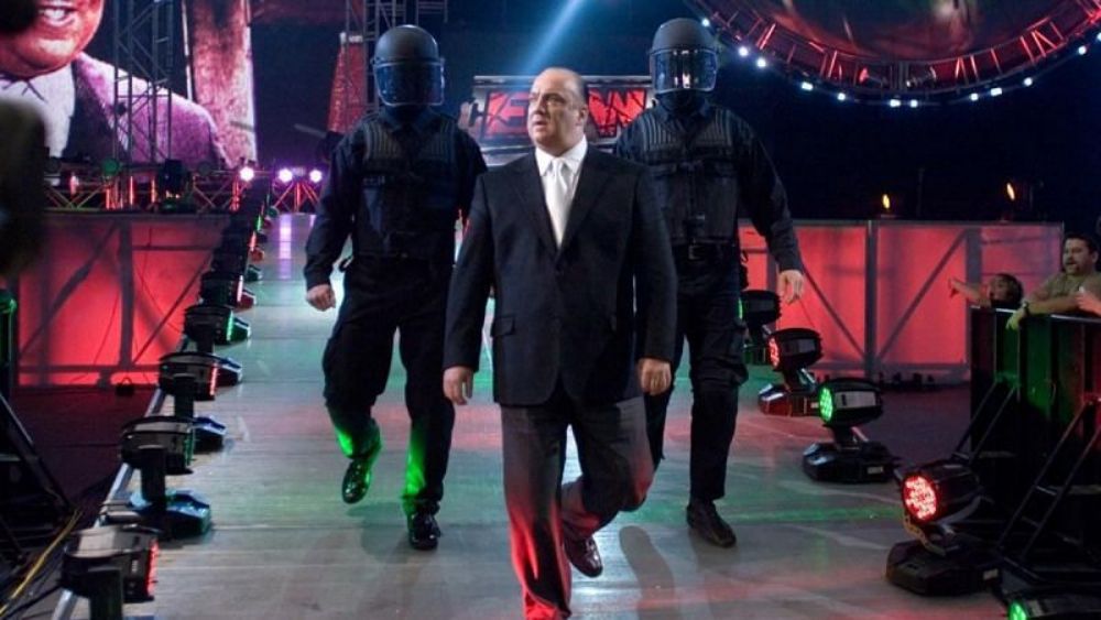 Paul Heyman with his private security