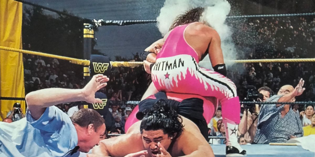 Mr. Fuji throwing salt at Bret Hart while he applies the Sharpshooter to Yokozuna