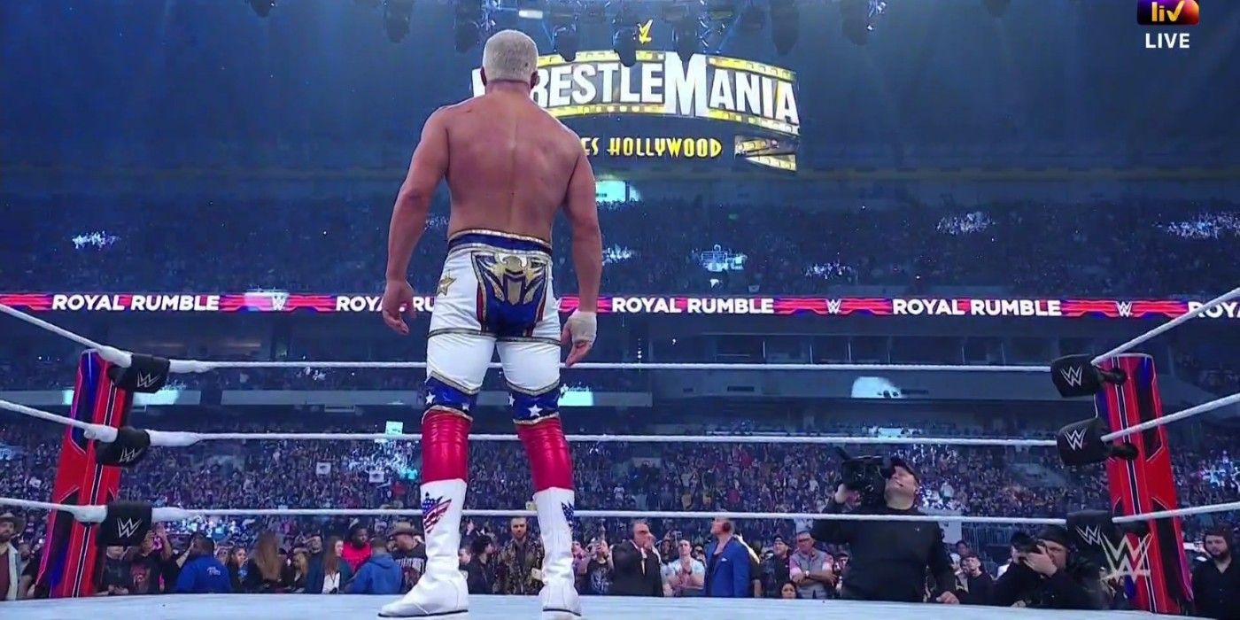 cody rhodes looking at the wrestlemania sign