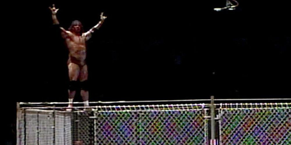 Jimmy Snuka atop a steel cage.
