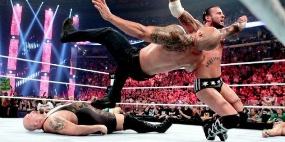 CM Punk attacks The Rock Cropped