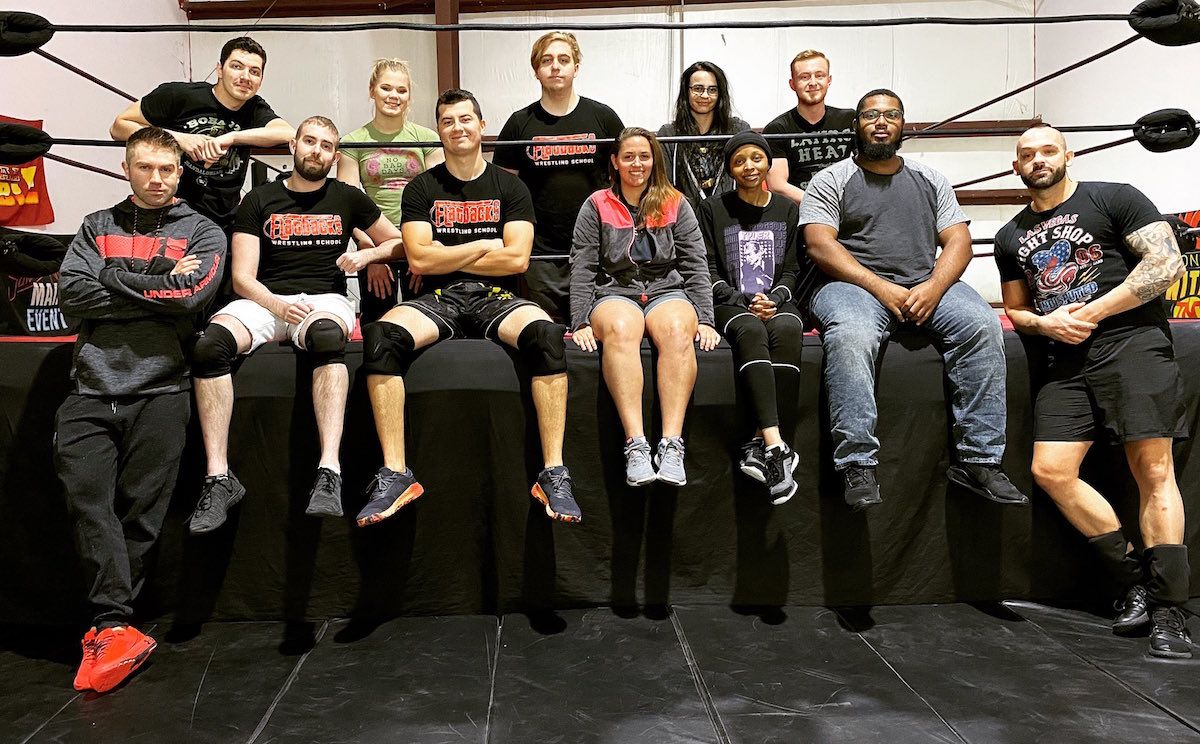 Tyler Breeze and Shawn Spears with students at Flatbacks Wrestling School