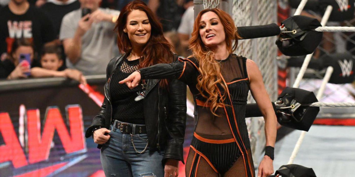 lita smiling and becky lynch pointing