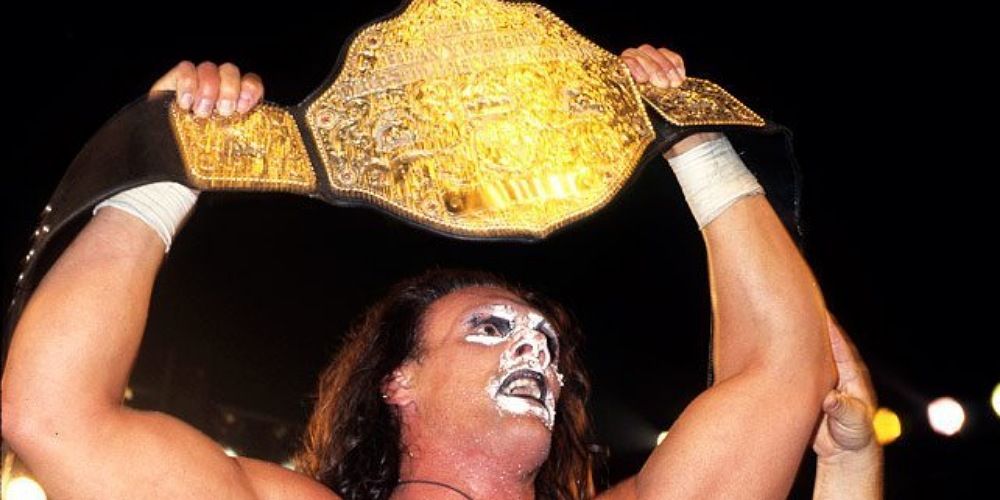 Sting holding up the WCW Championship. 