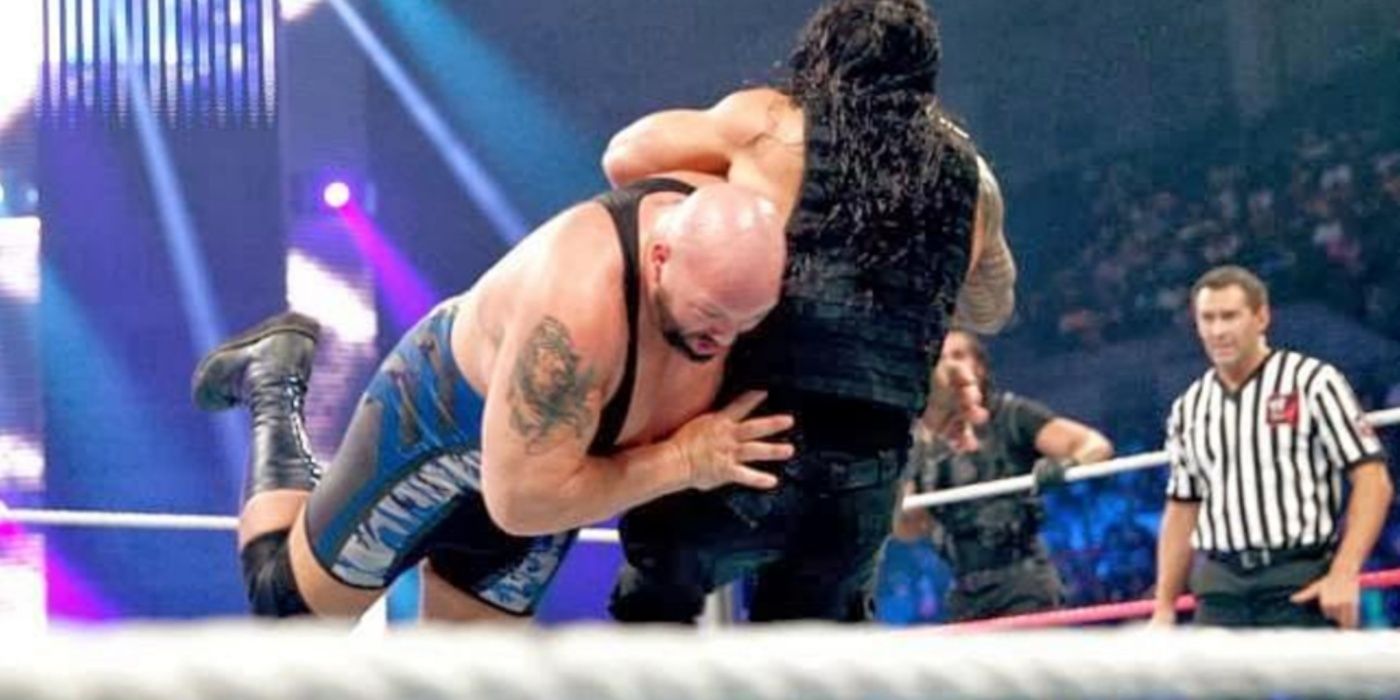 Big Show hits Roman Reigns with a spear