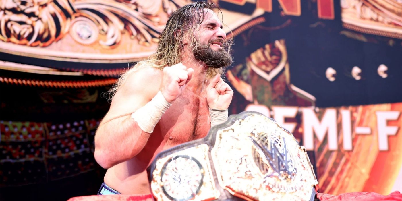 seth rollins cringing behind the new wwe world title