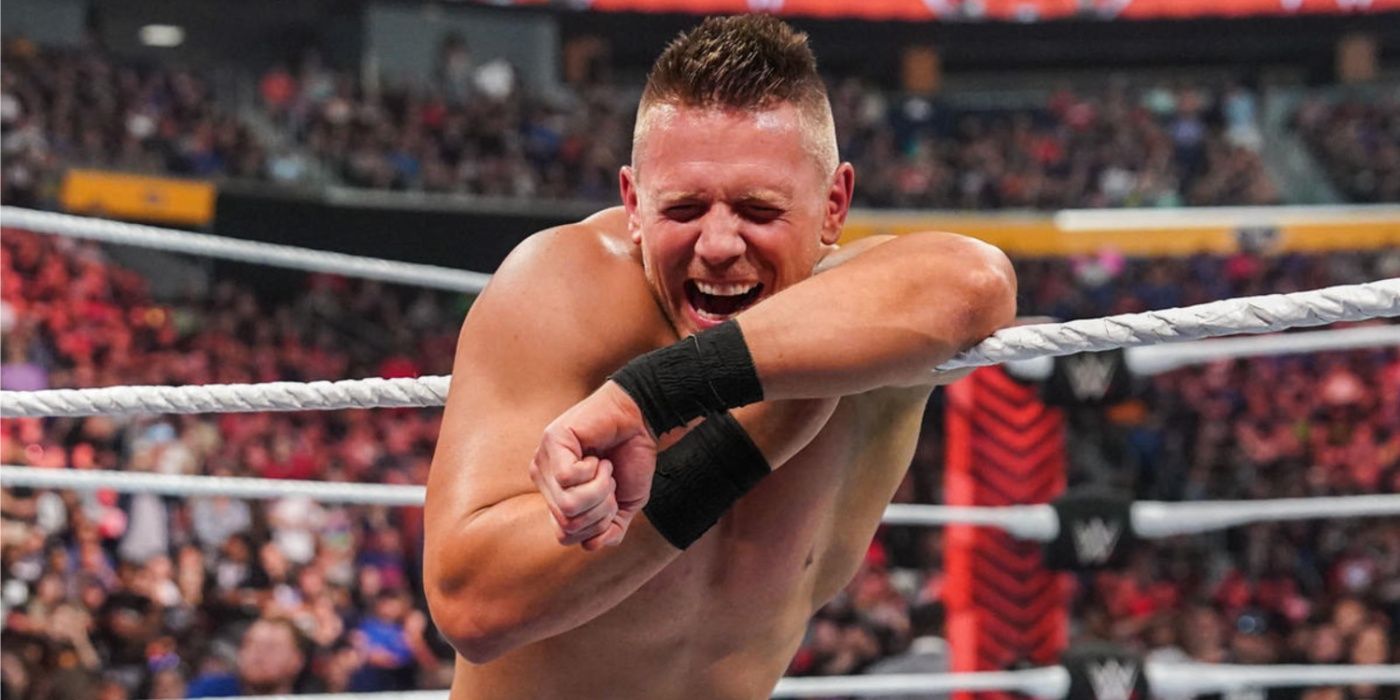 the miz leaning on the ropes and laughing