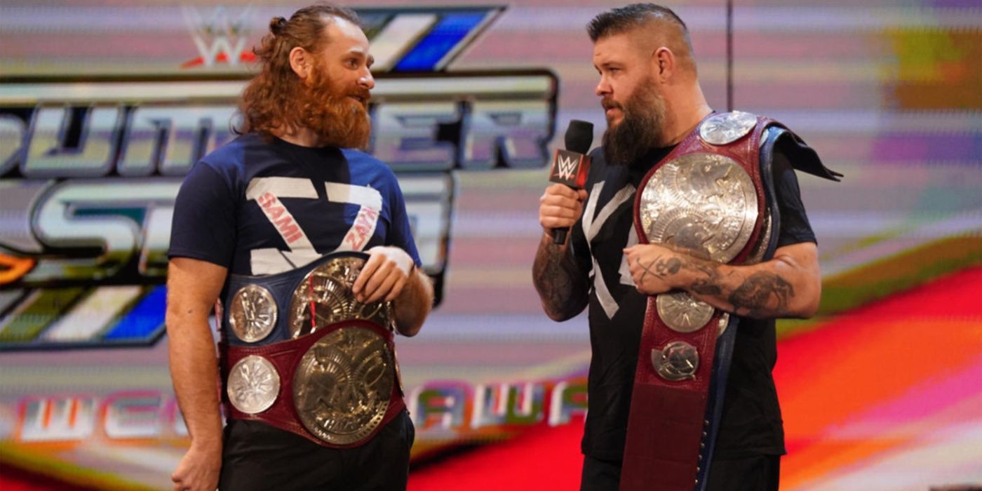 sami zayn and kevin owens with the tag team titles