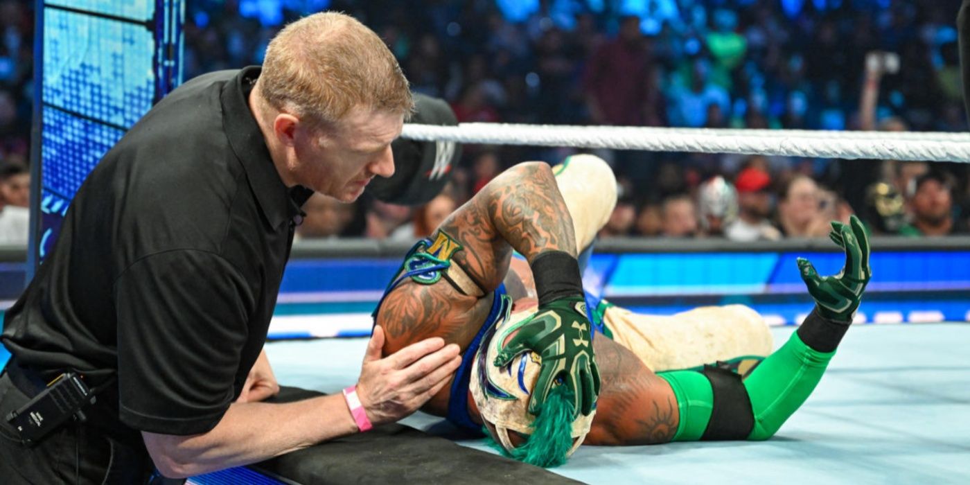 wwe doctor checking on rey mysterio