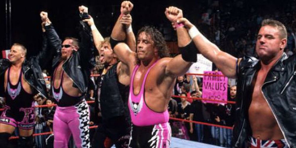 The Hart Foundation raising all their arms.