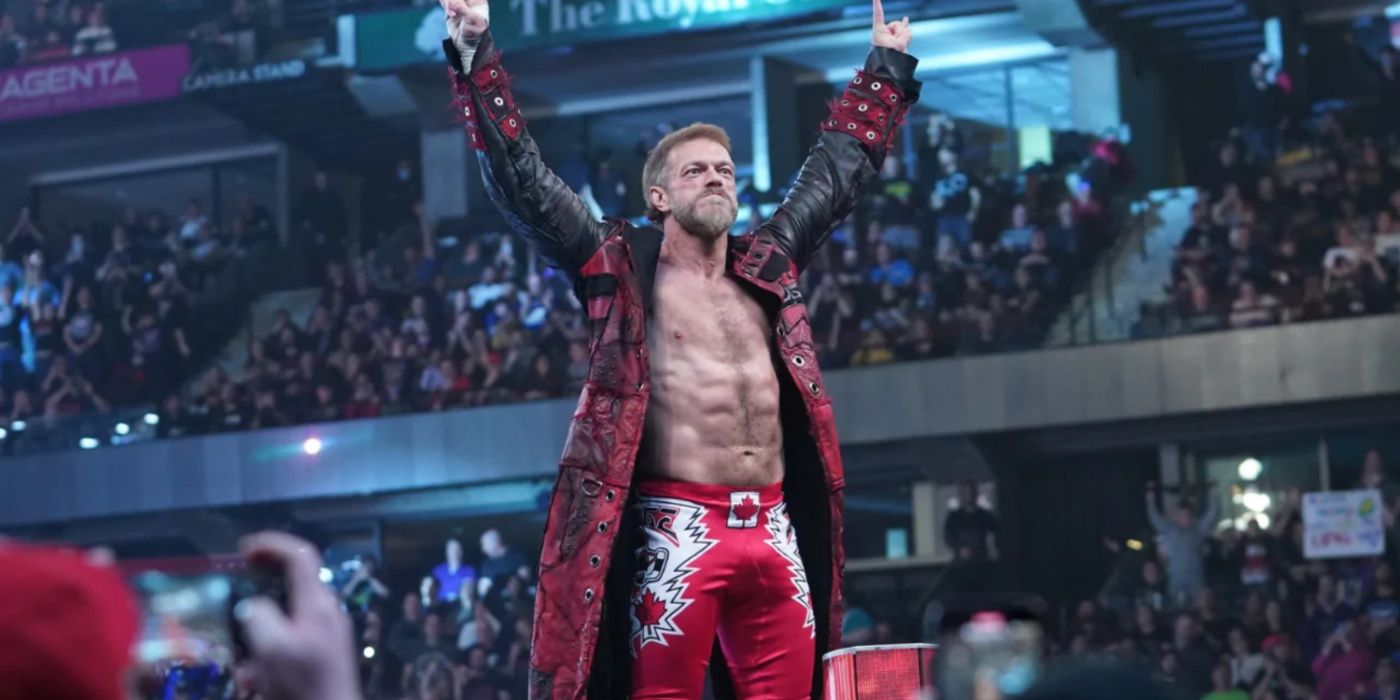edge holding his arms in the air