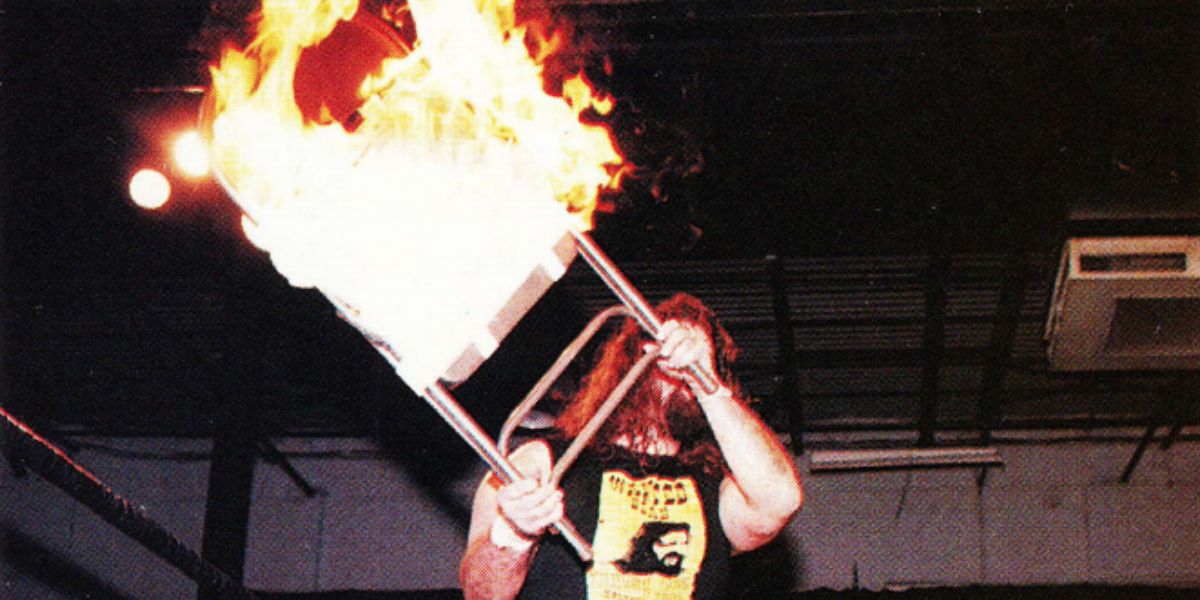 Cactus Jack with a flaming chair in ECW