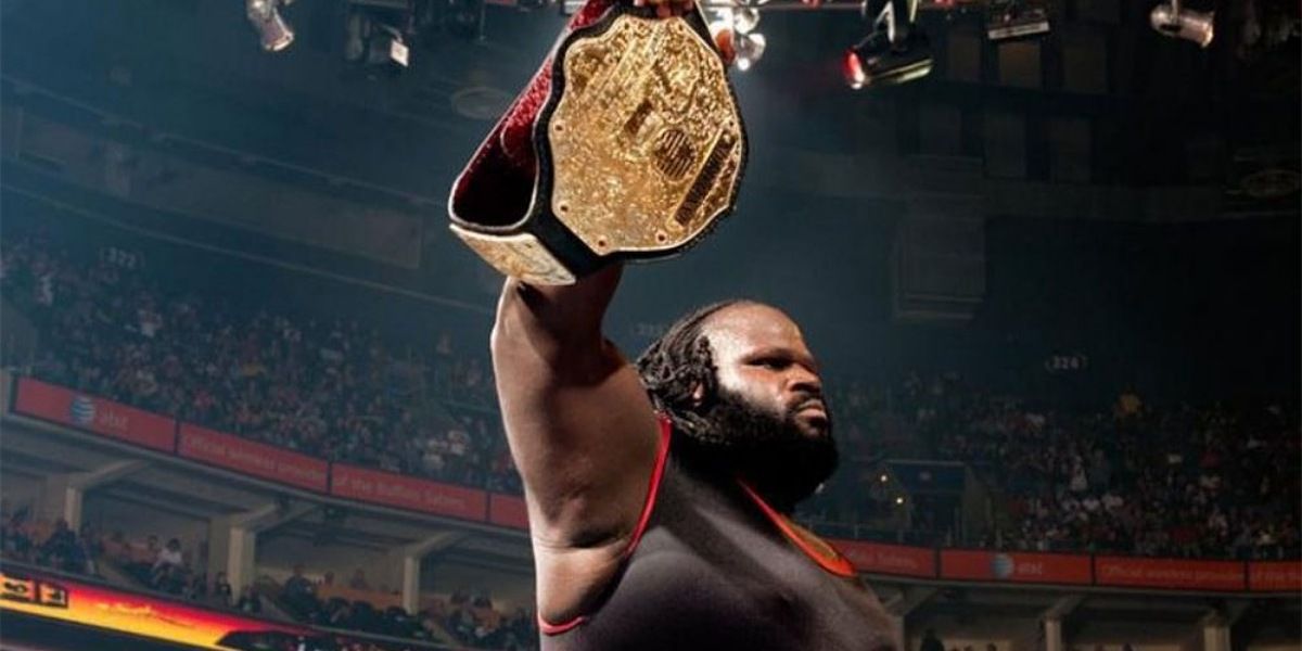 Mark Henry holding up the World Heavyweight Championship. 