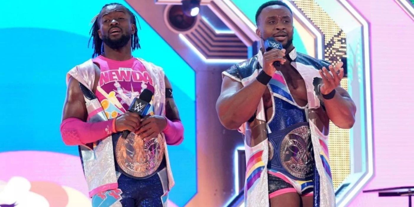 kofi kingston and big e wearing the smackdown tag titles