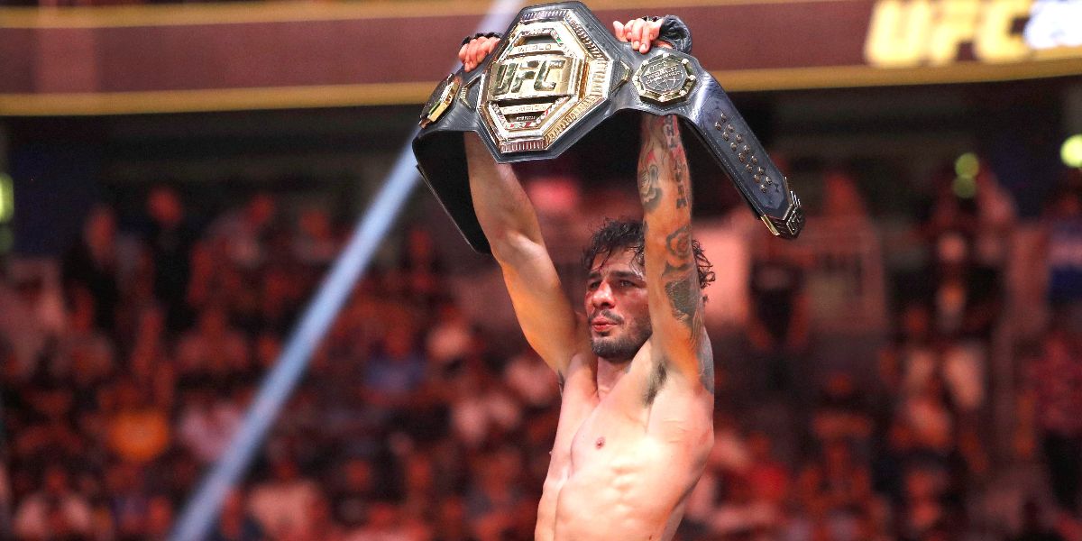 Alexandre-Pantoja-posing-with-a-title