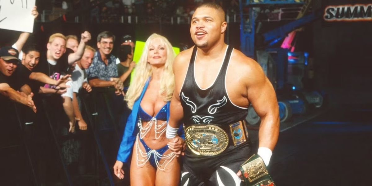 D'Lo Brown making his entrance with Debra