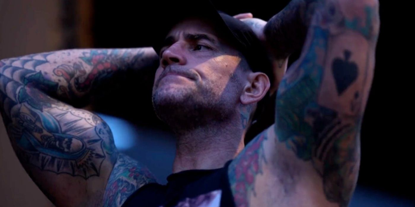 cm punk exasperated with his hands on his head