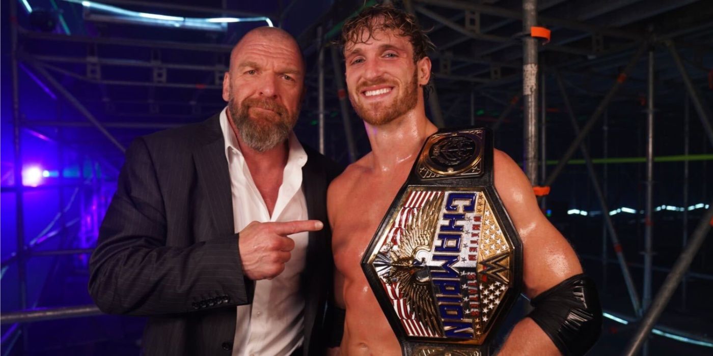 triple h pointing to logan paul with the us title
