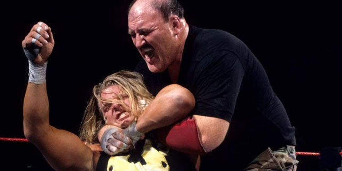 Sgt. Slaughter locks Triple H in the Cobra Clutch during their Boot Camp match