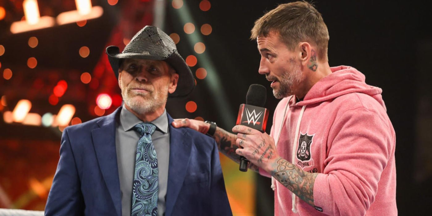 cm punk with his hand on shawn michaels' shoulder