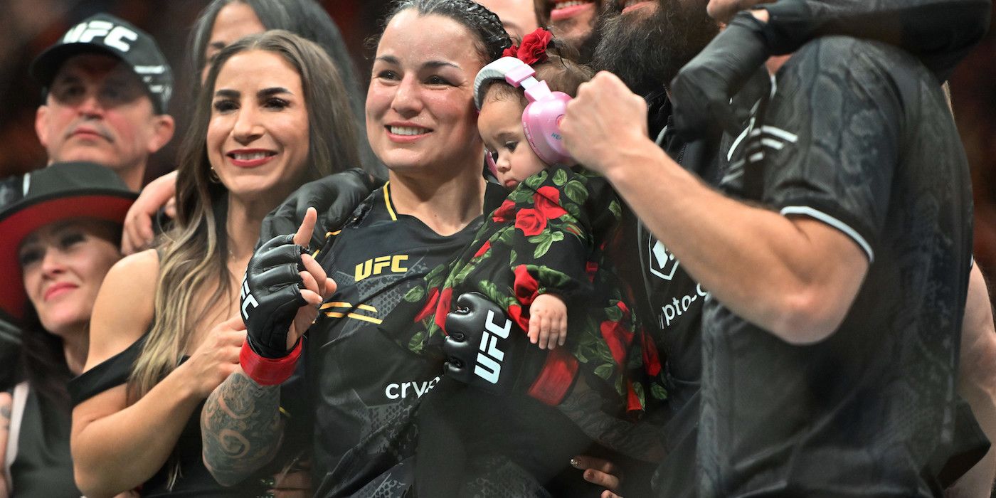 Raquel Pennington celebrates her UFC win with her baby
