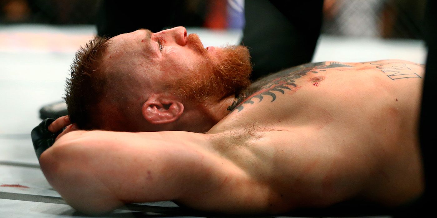 Conor McGregor stares at the ceiling after losing at UFC 196