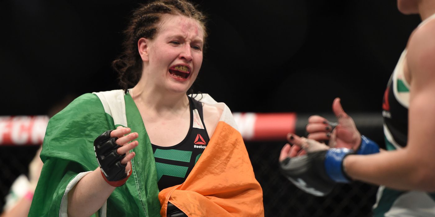 Aisling Daly holds the Irish flag after a UFC fight