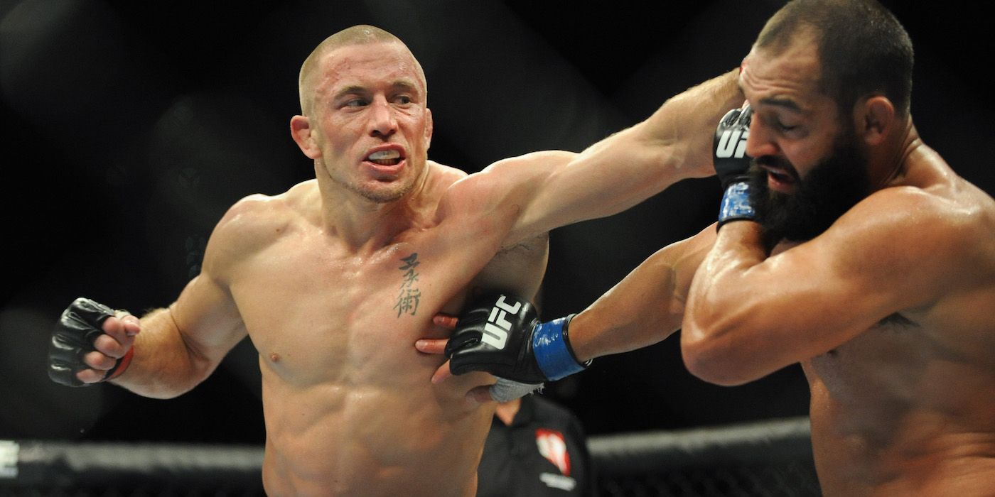 GSP punches Johny Henricks in the UFC octagon